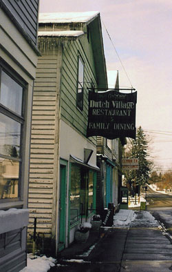 Photograph of restaurant with sign: Dutch village restaurant - family dining