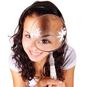 woman holding a looking glass