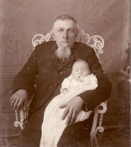 Old man holding a baby