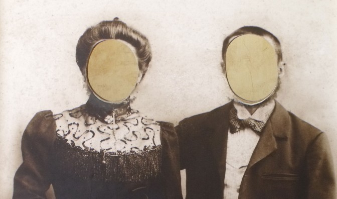 Old photograph with the faces cut out