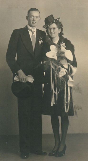 Young couple, the woman holds a bouquet of arums in her hand