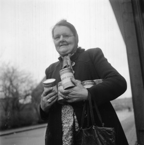 Woman carrying food distributed by allied forces, World War II
