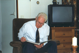 Henk going over the family book