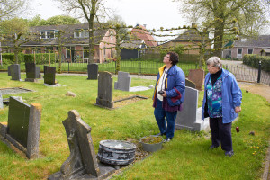 Roberta (left) and Cheryl locating the graves of their distant cousins at the Baard Cemetery