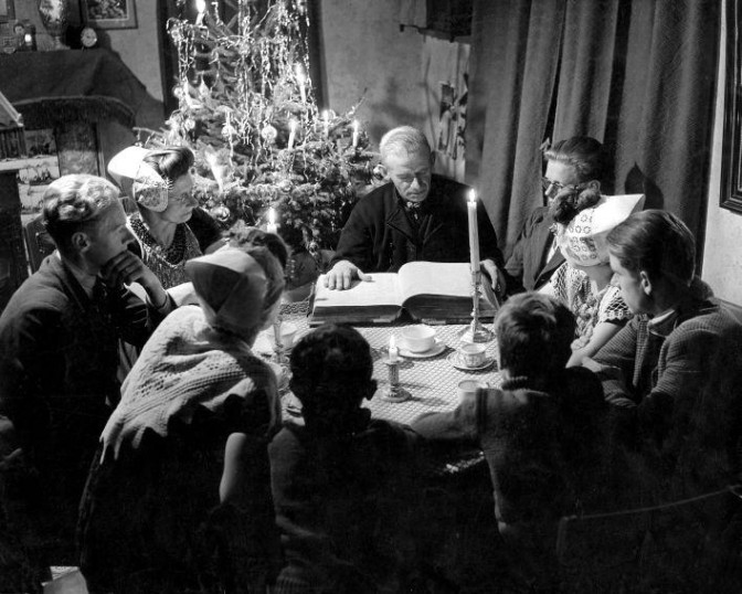 Family gathering around the table for Christmas