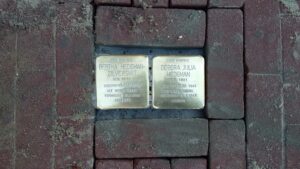 two bronze monuments in the pavement