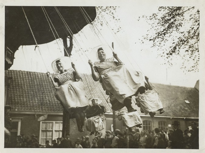 Dutch women in traditional costume in a carousel