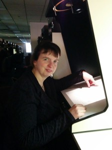 Yvette behind microfilm reader