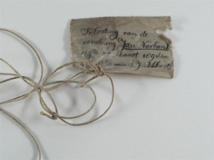 handwritten label on a piece of string