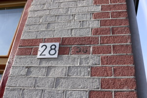 House number 28, with faint number 36 next to it