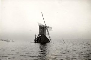 windmill surrounded by water